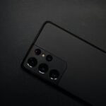 black remote control on black textile