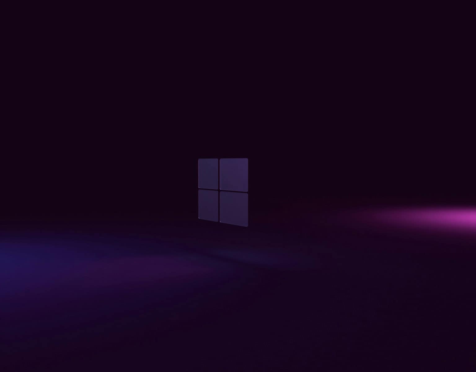 a dark room with a purple light coming out of the window