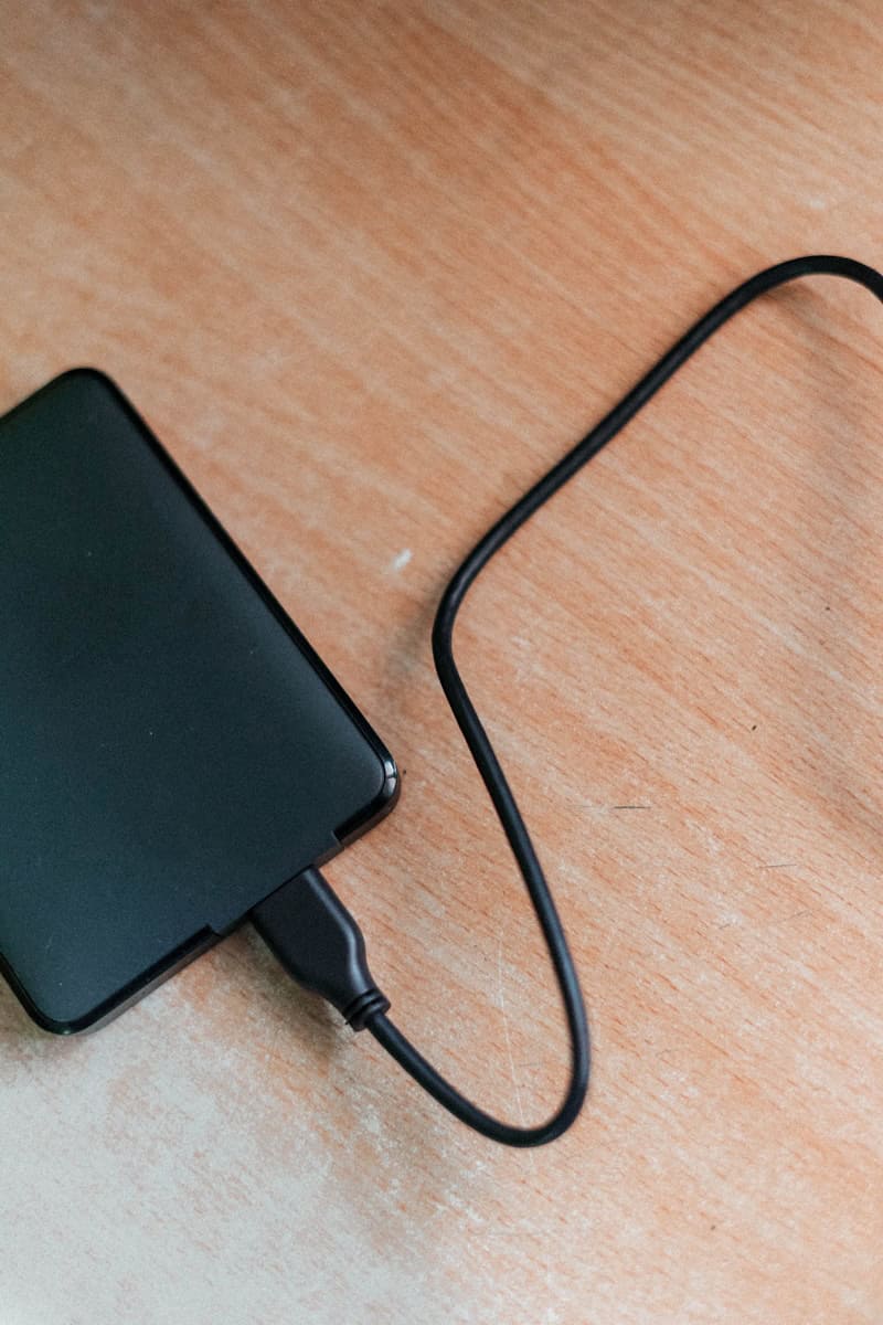 black usb HDD on wooden table