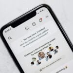 silver iphone 6 on white table