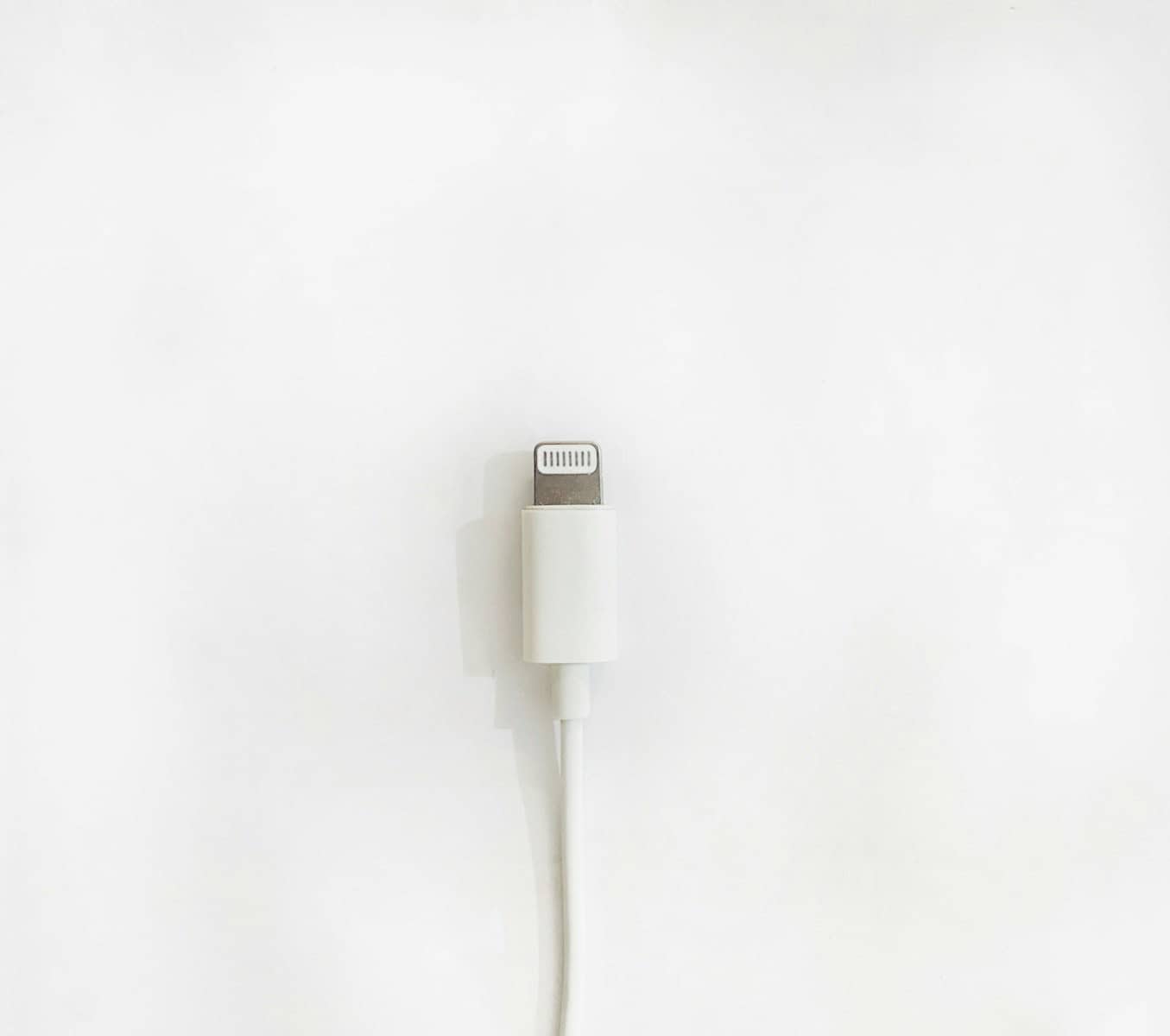 white usb cable on white surface