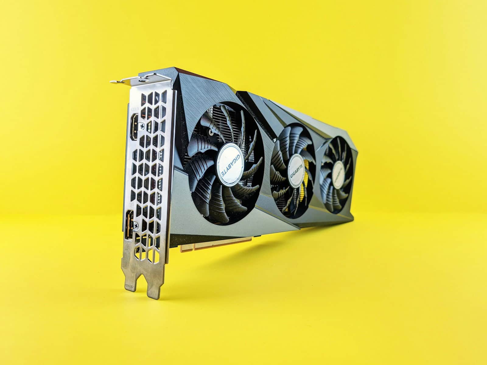 a close up of a computer fan on a yellow background