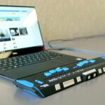 a laptop computer sitting on top of a desk