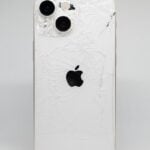 a white iphone with a cracked screen