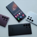 a group of three different cell phones sitting next to each other