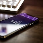 space gray iPhone X smartphone turned on