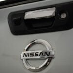 a close up of a nissan emblem on a car