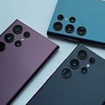 a group of four different colored cell phones