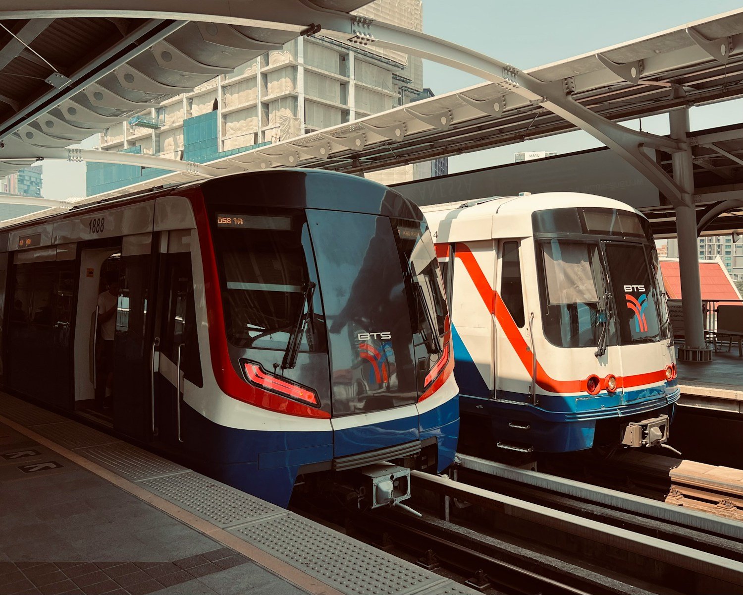 a couple of trains parked next to each other