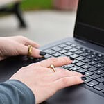 a person typing on a laptop