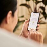 A woman looking at a contract on DocuSign from a iPhone