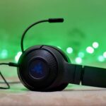 black and blue headphones on brown wooden table