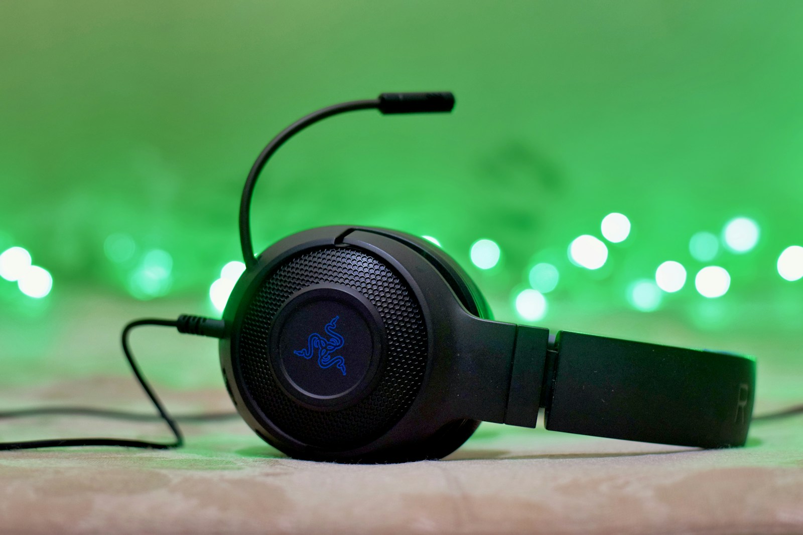 black and blue headphones on brown wooden table