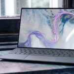 laptop on brown wooden table