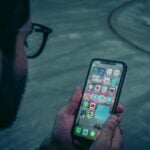 person holding black iphone 5